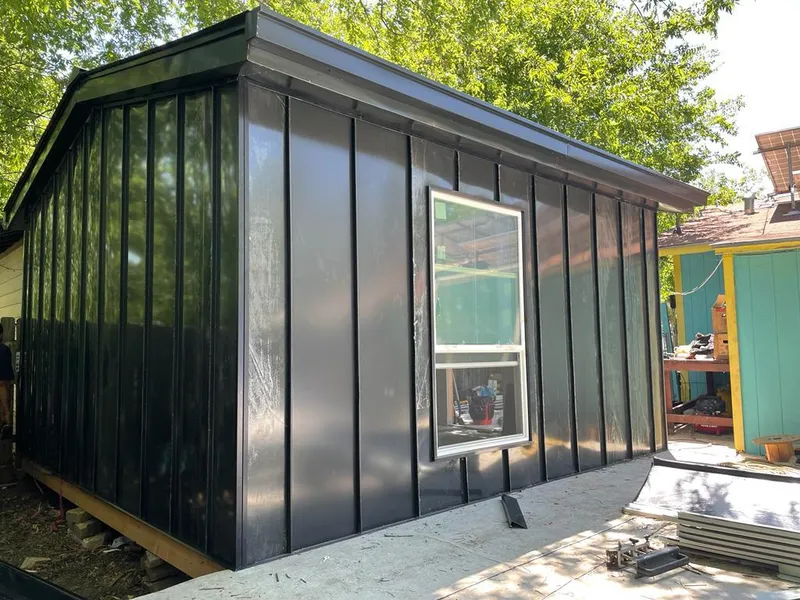 Black standing seam metal wall panels for Roof Inspection in Bullard